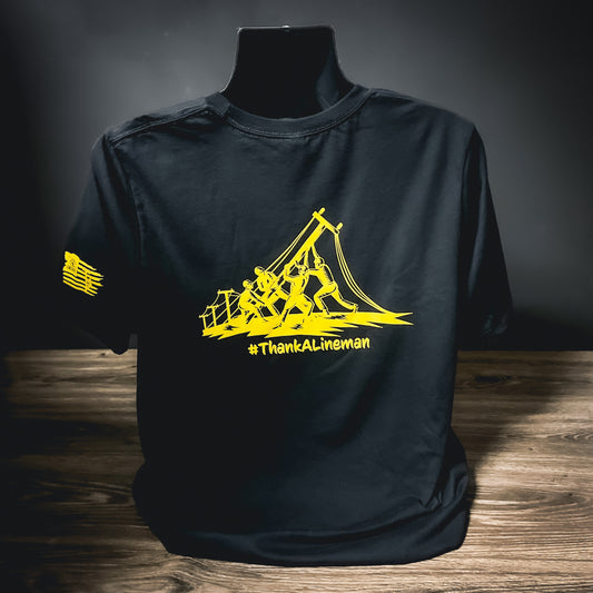 #ThankALineman black t-shirt with yellow lineman graphic and LineCrate logo on the sleeve.