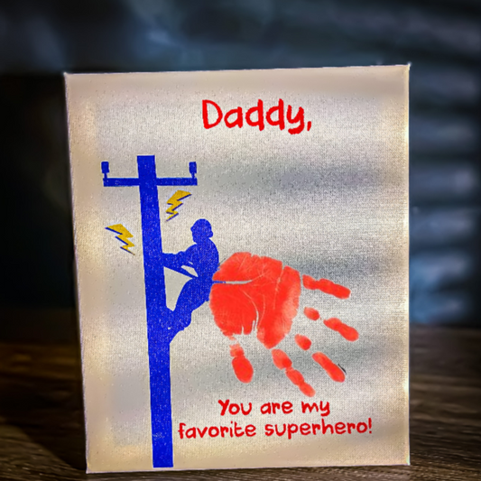 Canvas art project with a red child’s handprint for a LineMan superhero cape.