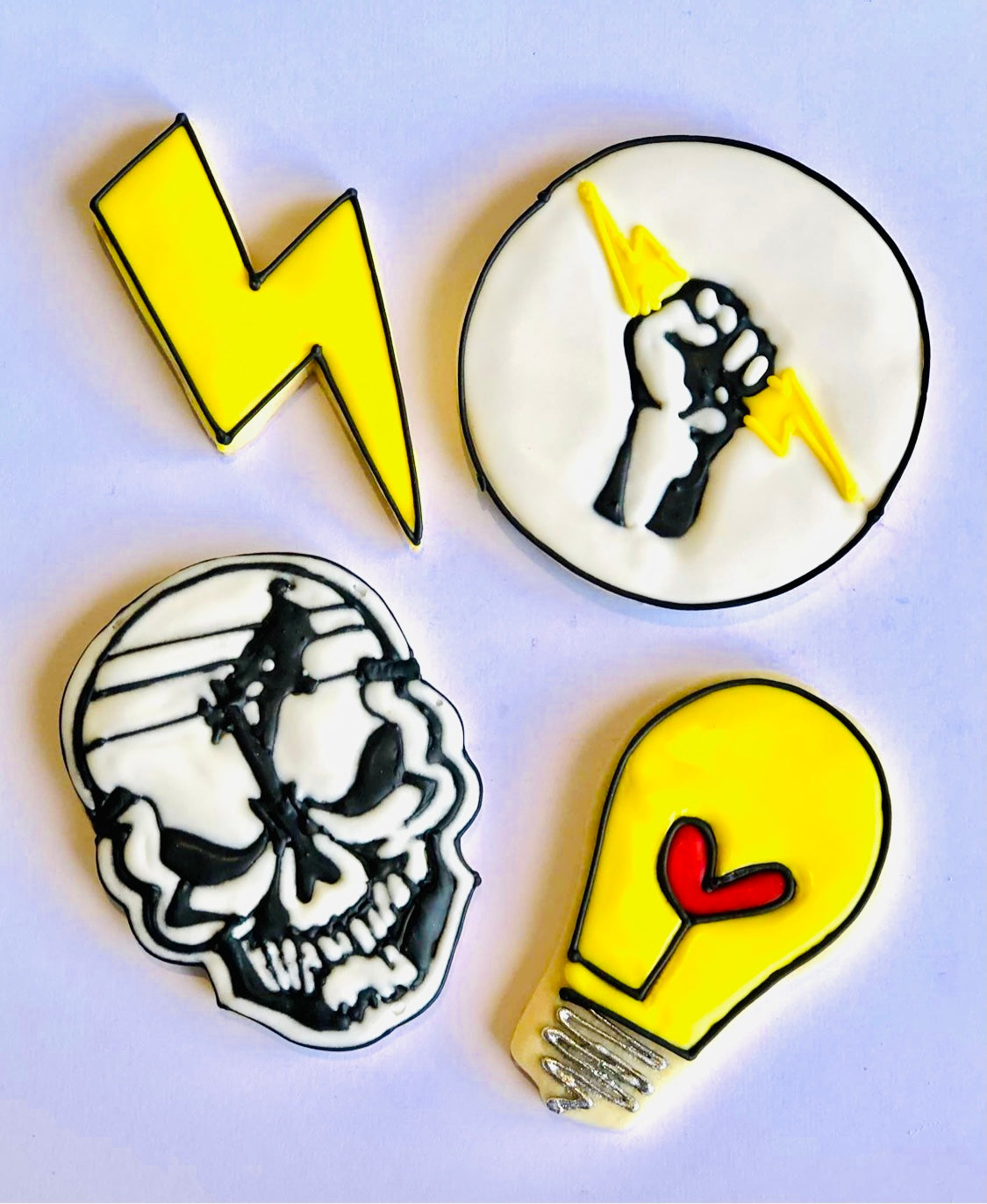 Lineman skull, lightbulb, lightning bolt, and fist icing examples