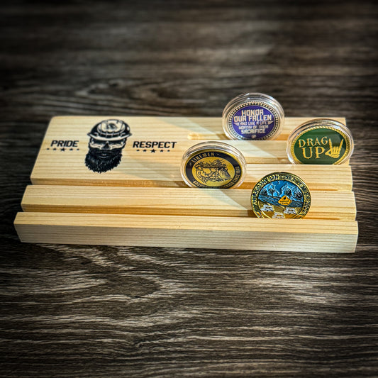 Wooden coin holder with grooves, designed to display and hold challenge coins upright on a natural wood surface