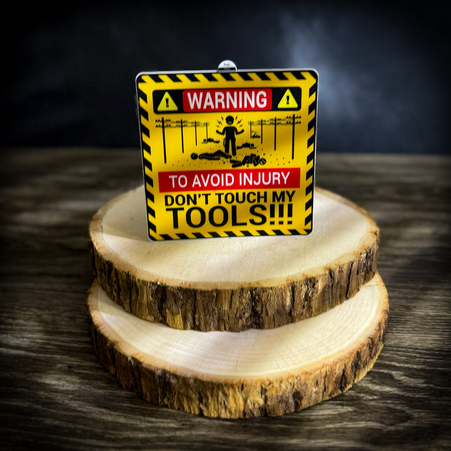 Yellow and black 'Don't Touch My Tools' warning sticker with lineman graphics, designed for toolboxes. Bold red text emphasizes safety and ownership of tools.