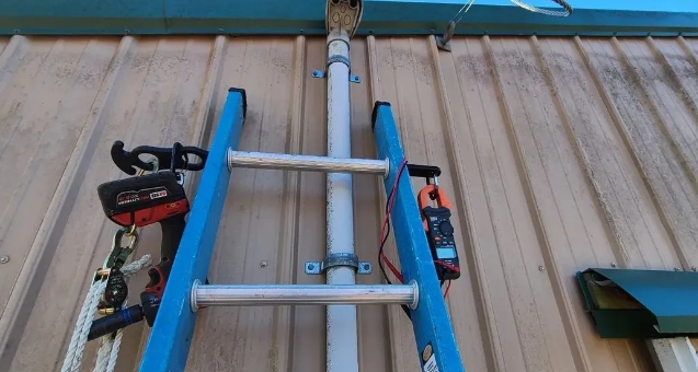 Close-up of Rung Rack in use on ladder rungs, organizing tools for easy access