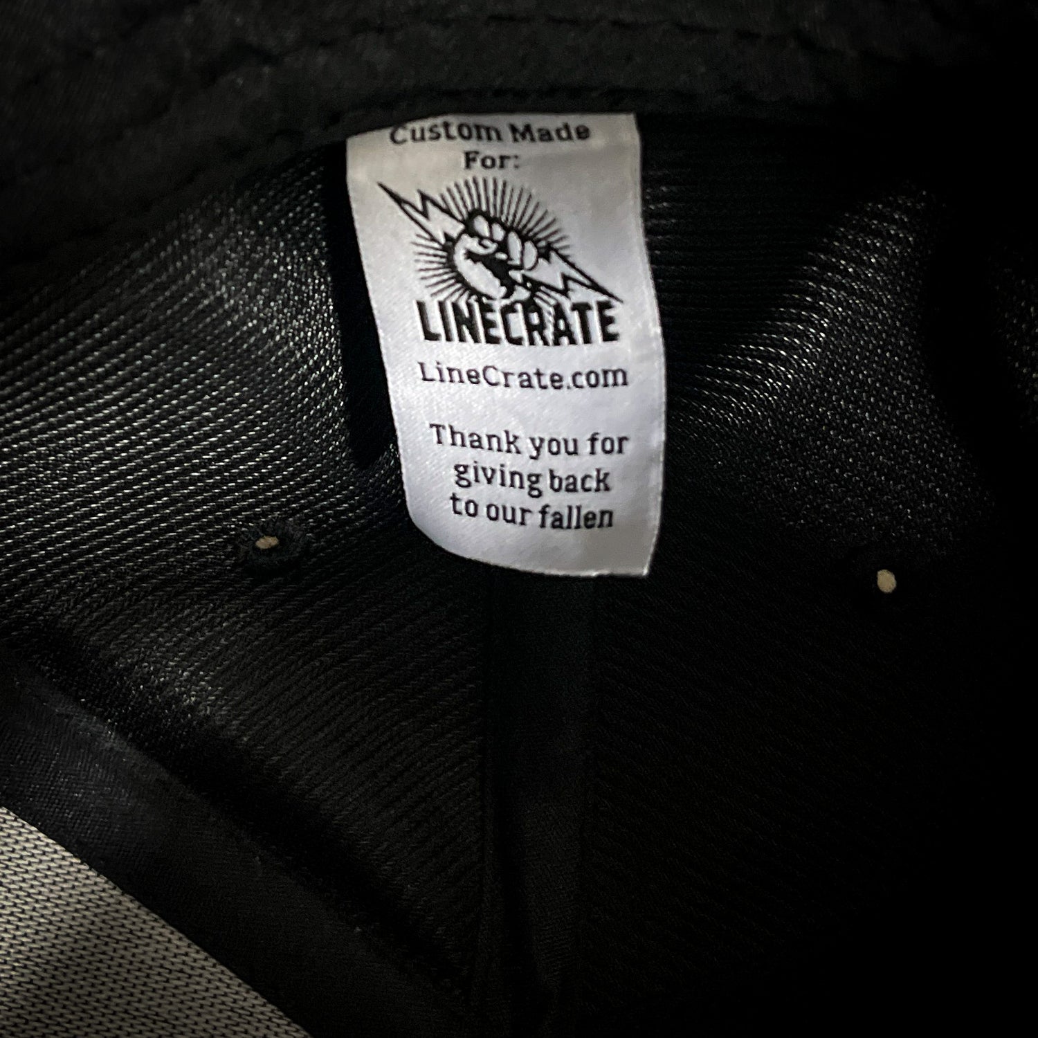 Custom LineCrate label inside hat with a message thanking customers for giving back to our fallen linemen