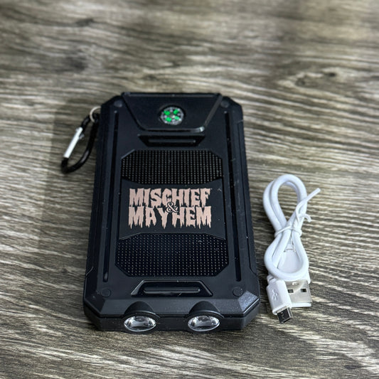 Mischief & Mayhem power bank with dual LED lights, compass, and carabiner, perfect for linemen and blue-collar workers